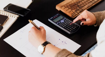 a person calculating their finances