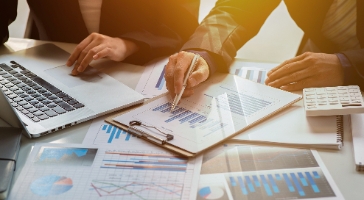 people reviewing financial documents