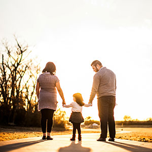 A young family going on a walk