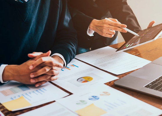 two people reviewing financial documents