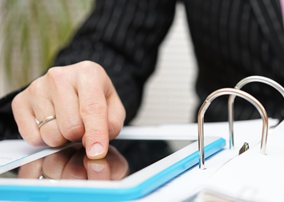 a person viewing a tablet