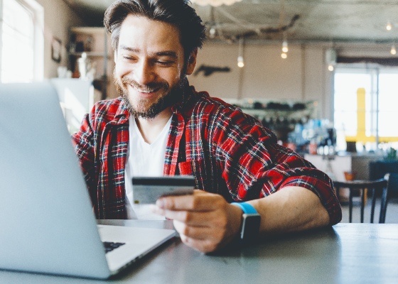 a man making an online purchase with his credit card