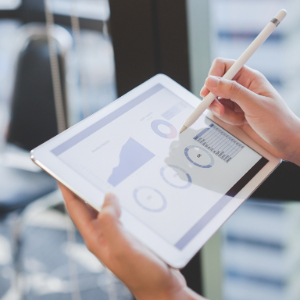 financial graphs and charts on a tablet
