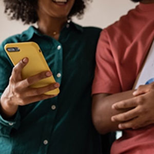 A couple looking at a smartphone